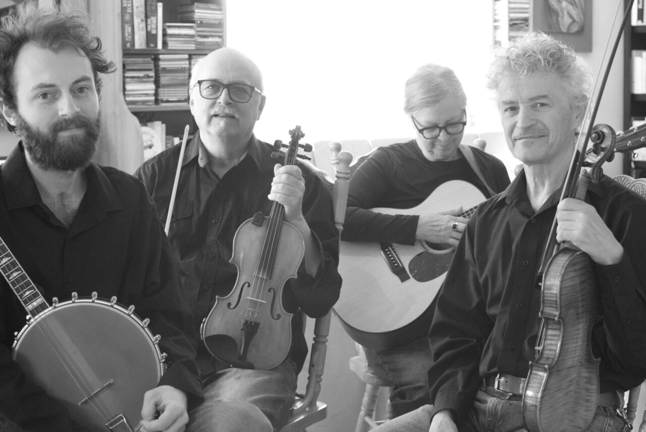 Black and white photo of the band - Aimé, Claude, Dana and Mario