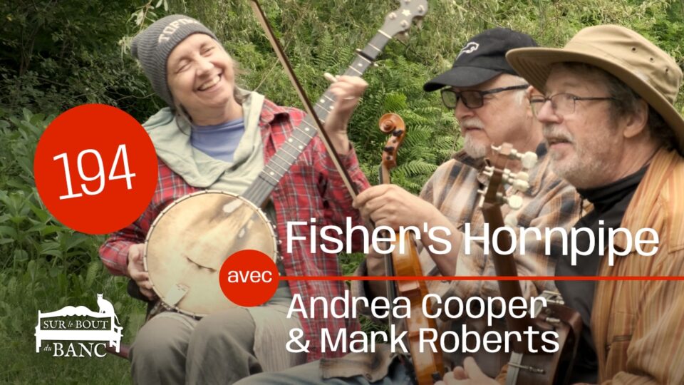 A woman and man playing banjos sit on a bench with a fiddler, outdoors with trees in background.