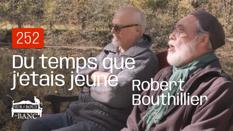 Deux hommes chantent sur un banc à l'automne.